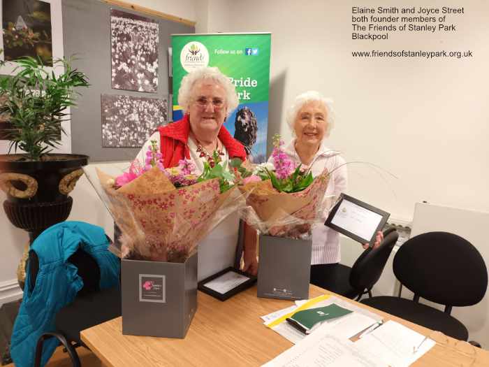 Elaine Smith and Joyce Street receive bouquets at the AGM April 2022